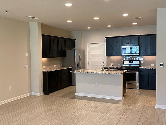 Open concept living/dining room, and kitchen.