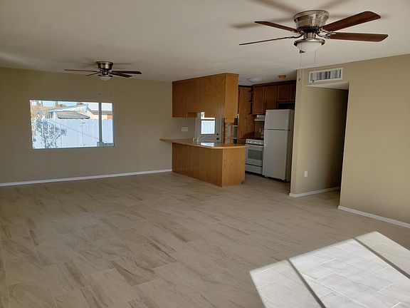 Big front room with ceiling fans