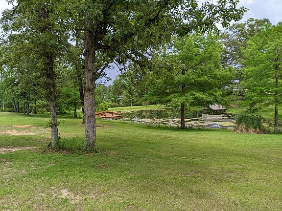 Private Pond on 3 acres. Landlord's home is across the pond past the boathouse.