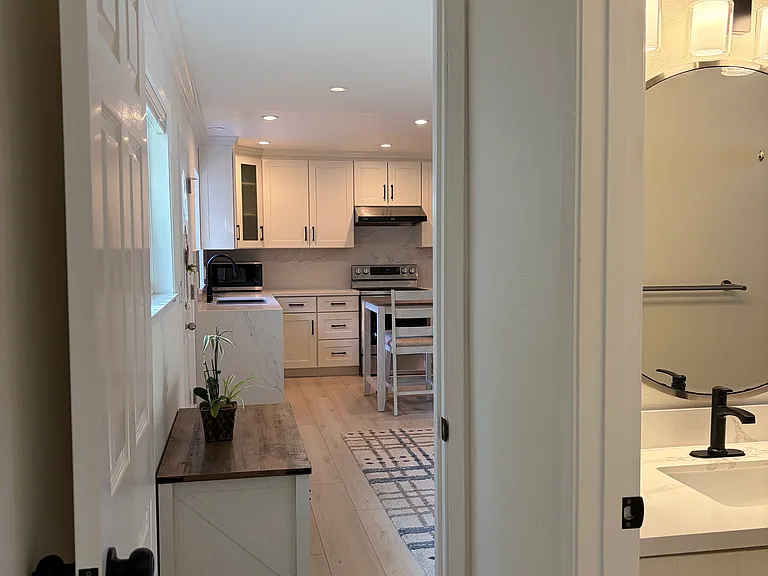 From master bedroom suite to living room and kitchen.