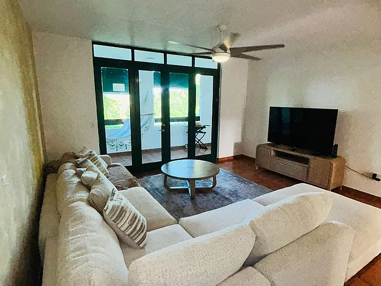 Bright and comfortable living room with TV, high-speed internet, and cable included