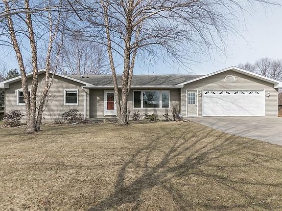 Beautiful ranch with oversized two stall attached garage on one acre.