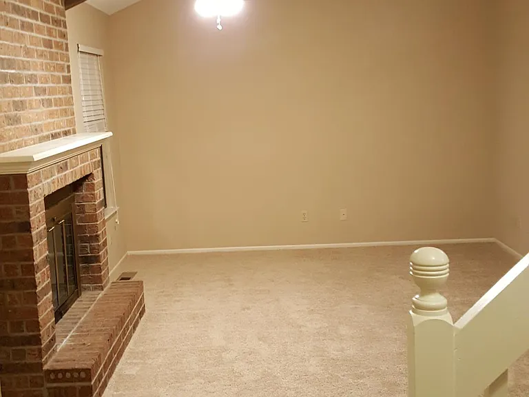 Living room with wood burning fireplace