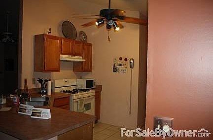 Kitchen
						:
						The stove is gas. Ceiling fans are in each room.