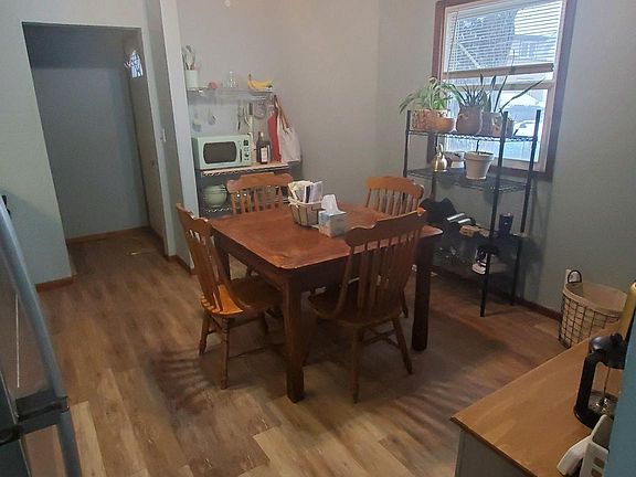 View from living room into kitchen. Willing to sell bakers racks.