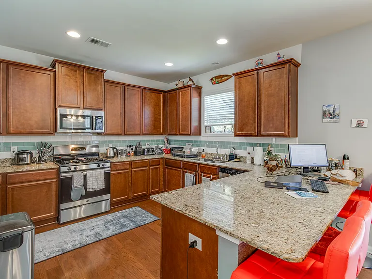 Spacious kitchen with granite counter tops