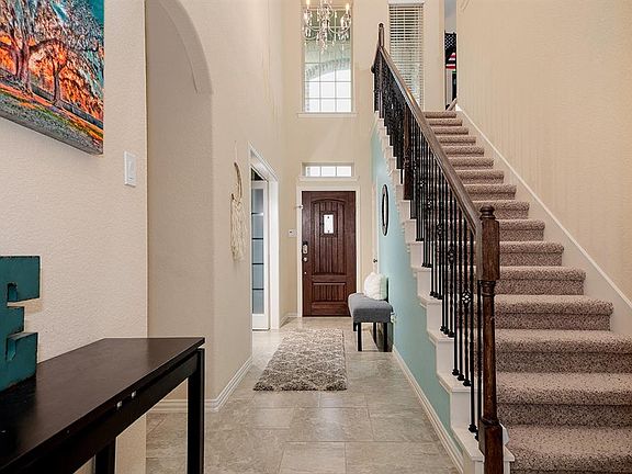 Tile floors, stylish fixtures and natural light welcome you home...