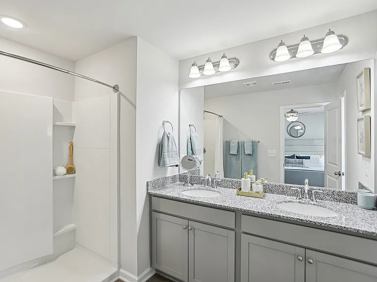 Large Bathroom with Dual Vanity and Shower Stall