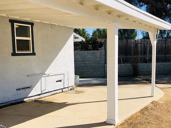 complete covered patio protects from afternoon sun.