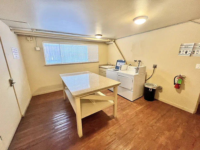 Experience convenience in this bright and airy laundry space, designed for easy living.