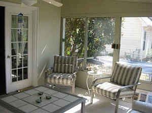 Enjoy the sunlight in the fully glass enclosed SUNROOM