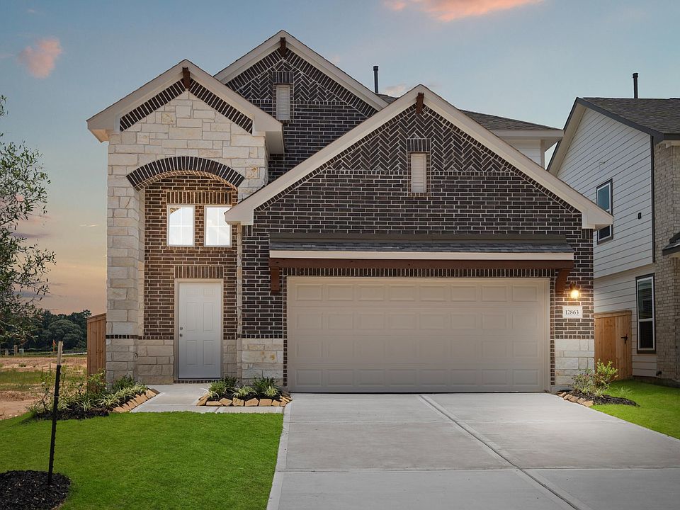 Welcome home to 12863 Lime Stone Lane located in the Stonebrooke community and zoned to Conroe ISD.