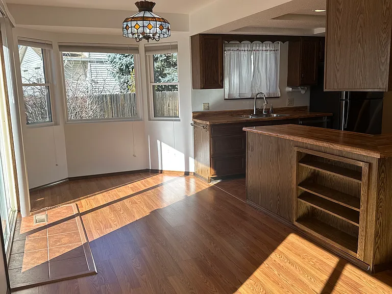Eat in kitchen space on back of home on main level.