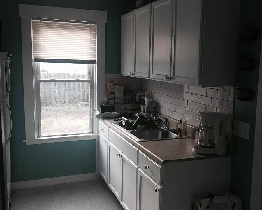Kitchen with appliances and subway tile backsplash