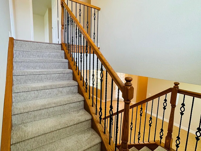 Stairs to second floor. Nice carpet (only carpeted area in home)