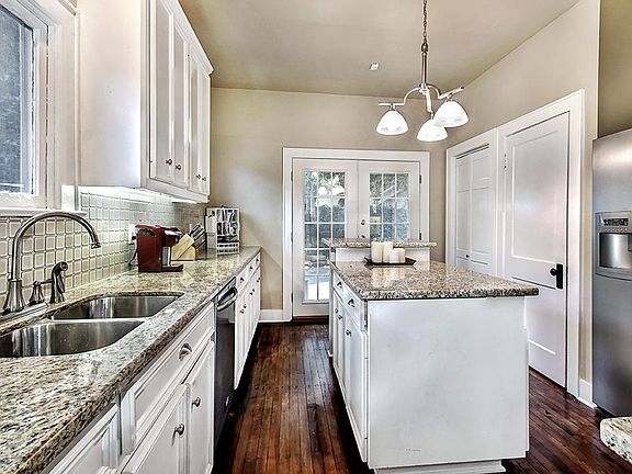 Gourmet kitchen offers granite counters, stainless steel appliances, island, pantry and undercounter