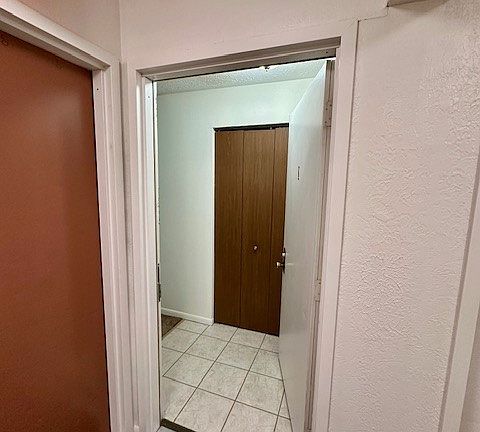 Entering into 2201 I from the hallway. Coat closet doors straight ahead
