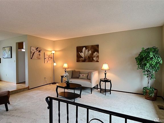 Coming in from the front door, showing the living room. House has all been freshly painted inside!