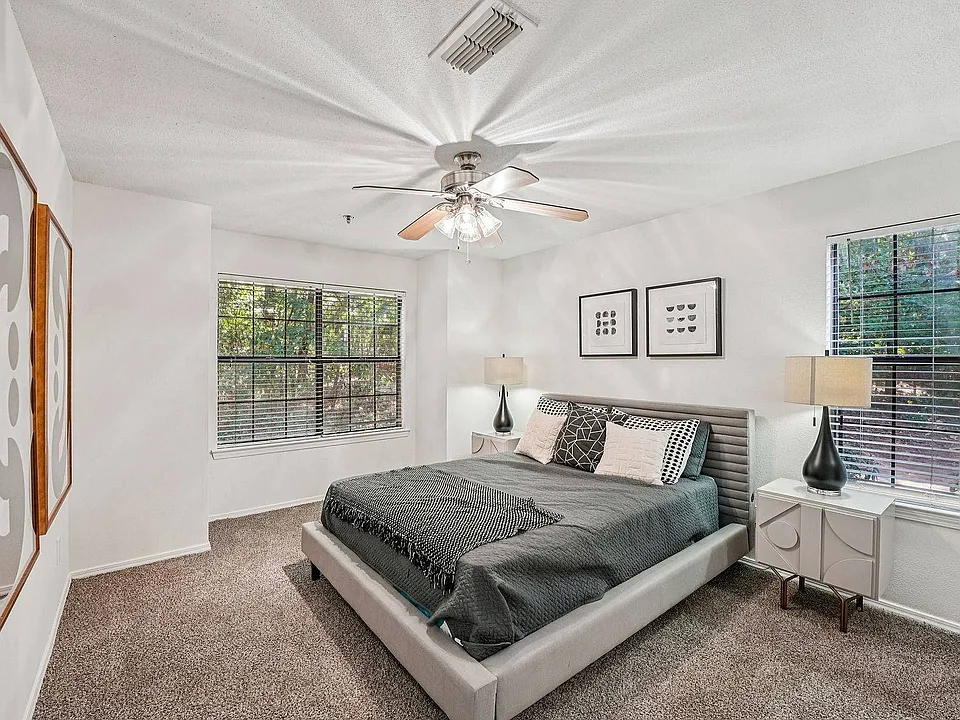 Experience comfort and style in this spacious bedroom at Avenues of Kennesaw in Kennesaw, GA.