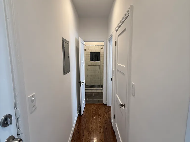 Hallway to Bedrooms, In-Unit Laundry, Utility Closet and Bathroom