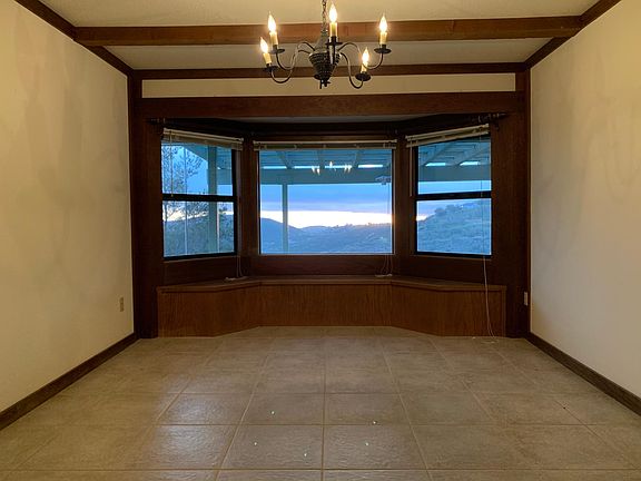 Formal dining room facing west. The bench seating below the windows open for extra storage.