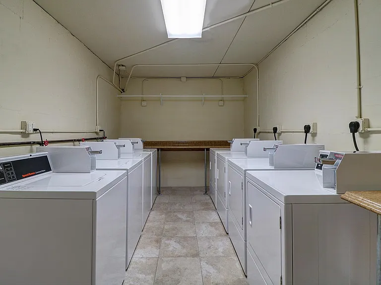 Laundry room with New Speed Queen washers and dryers