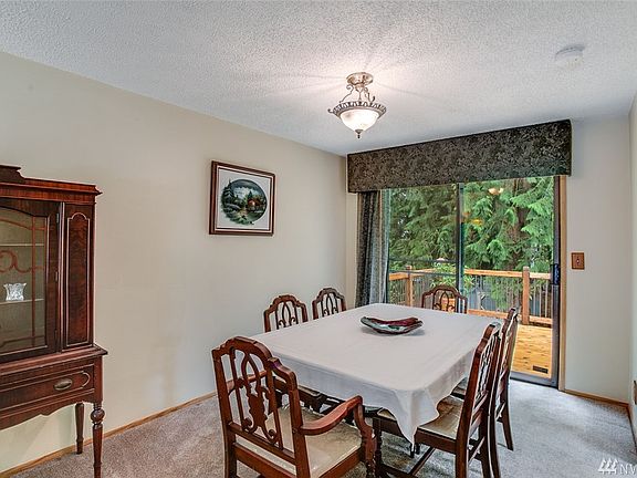 Spacious dining room opens to three level custom cedar deck.