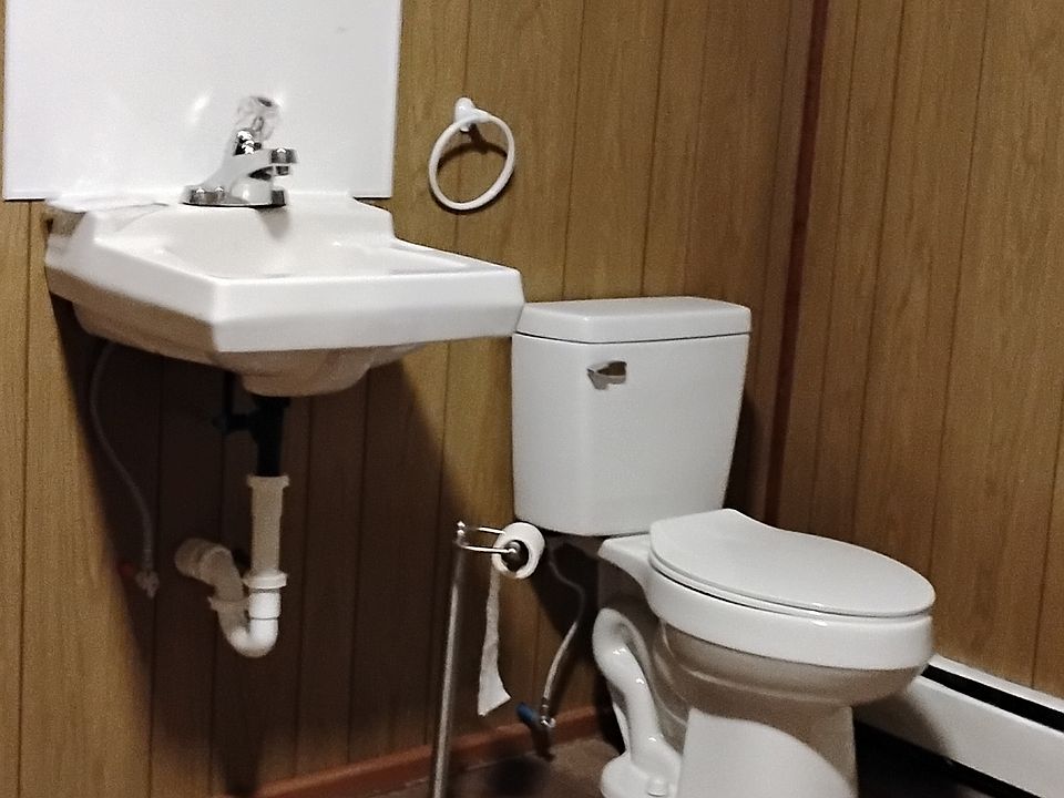 toilet and sink on first floor in laundry room