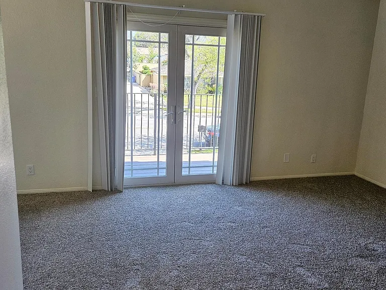 master bedroom with balcony