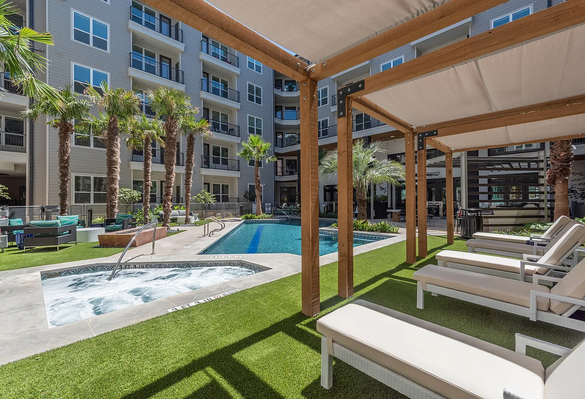 Sparkling Pool with Outdoor Covered Lounge Areas - Overture Domain 55+ Apartment Homes