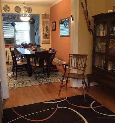 Living room with view into dining room