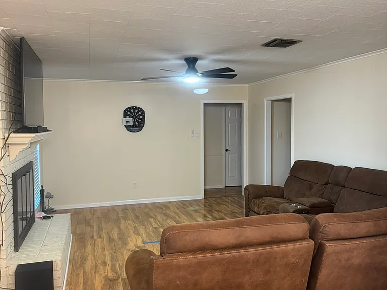 living room with tv and dart board