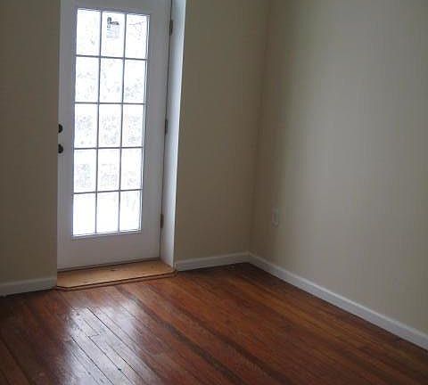 First level bedroom with door to patio