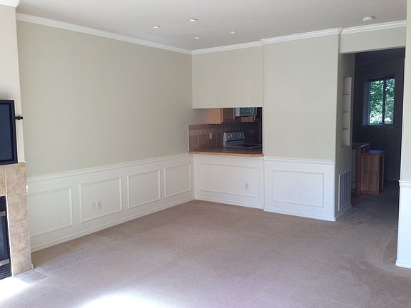 Large extended living room with double access to kitchen.