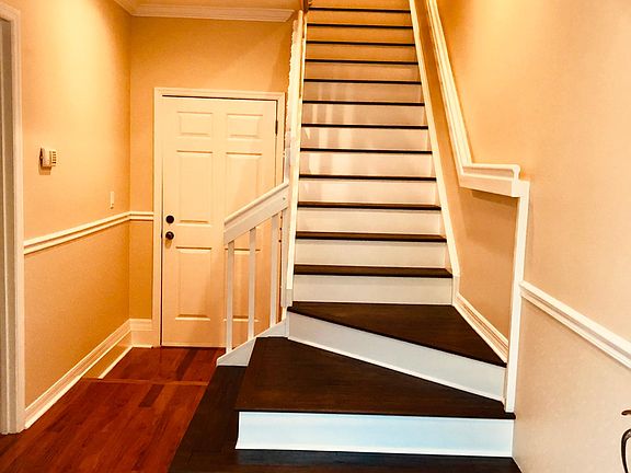 Ground Floor entry foyer leading up to second floor living/dining/kitchen/porch.
