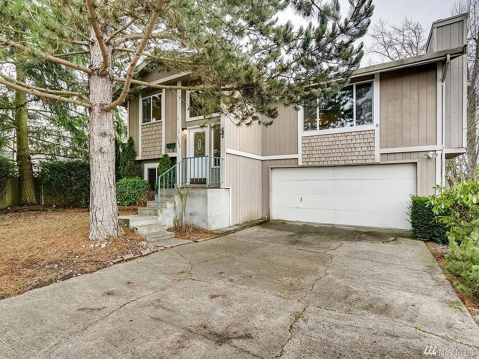 2 car garage with additional storage shed.