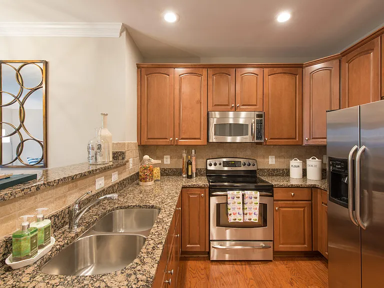 Granite countertops, recessed lighting and stainless steel appliances