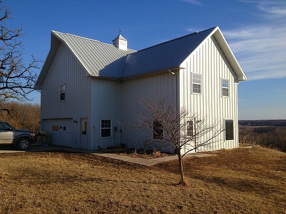 Lot slopes down after house