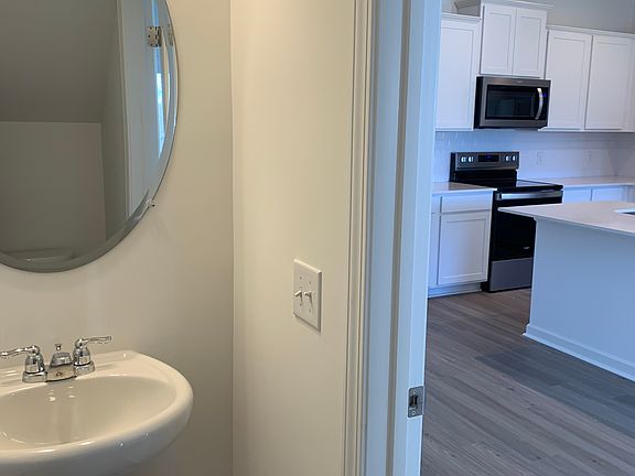 half bath off the living room and kitchen