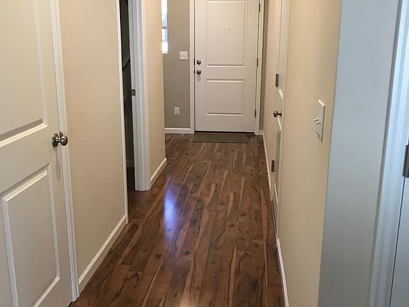 Entry hall to front door. Half bath 2nd door on the left. First door is storage area under stairs.