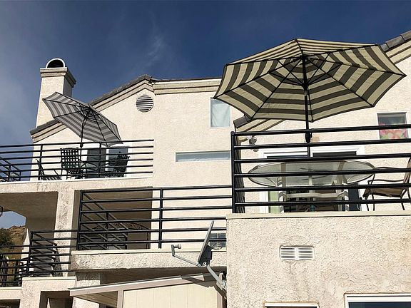 Front view. The back umbrella is where the apartment is located.