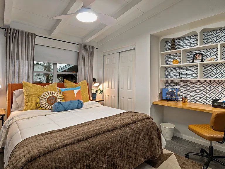 Bedroom three also features a dedicated work space or the perfect make up space.