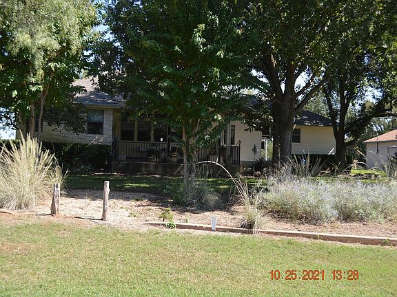 Back view of house, standing on golf course.