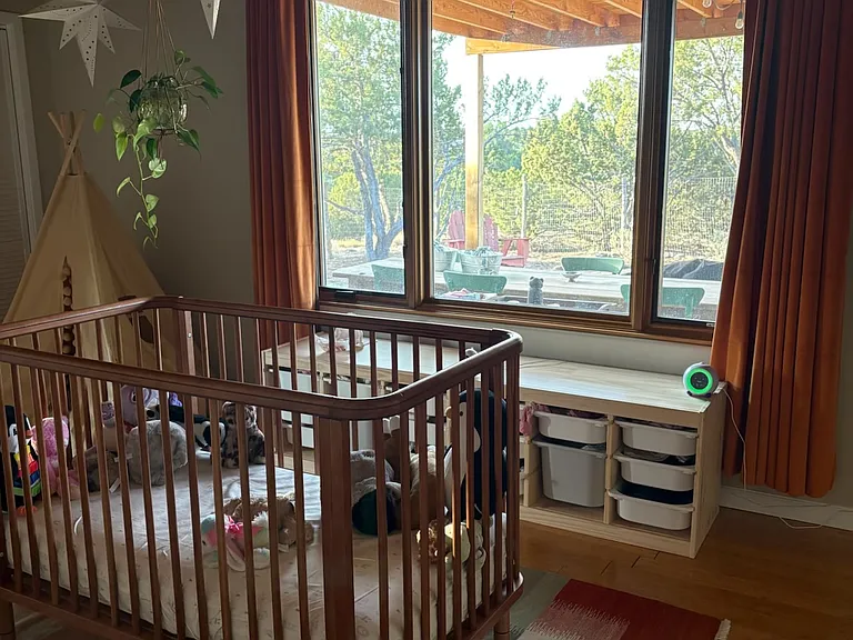 second bedroom with south facing windows looking out to backyard