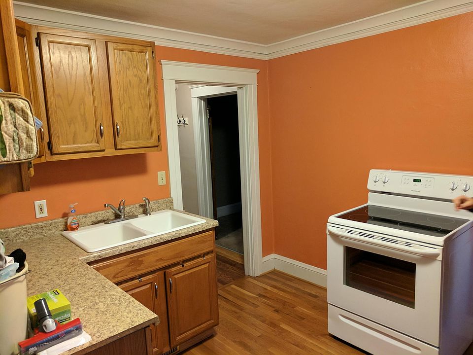 Kitchen has upper/lower wood cabinets. Newer electric stove. Hardwood floor. Large pantry. Three windows for natural light. Refrigerator. Double sink.