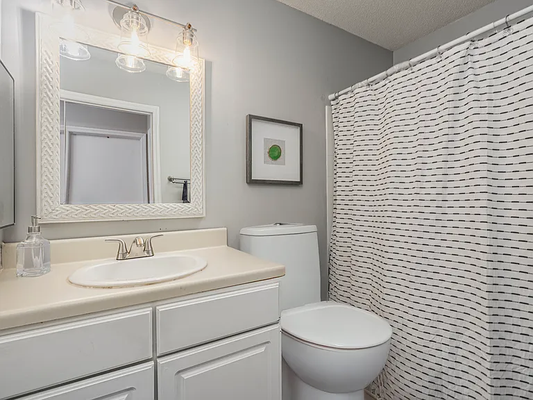 Upstairs bathroom with bath and shower