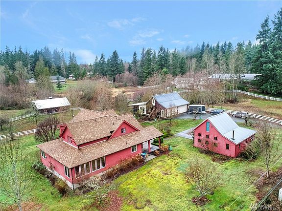 Gorgeous turn of the century farmhouse situated on 6.79 acres. Surrounded by white vinyl fencing.