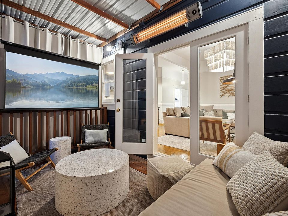 Your private outdoor movie theater with 80" projector, surround sound, and heated cabana nestled in garden foliage. Perfect for relaxing or entertaining!