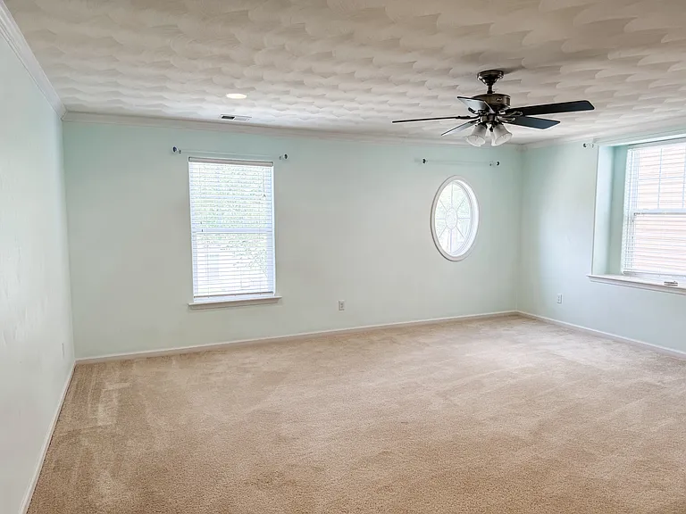 Fourth bedroom/finshed room over garage. Perfect for an office or kid's playroom!