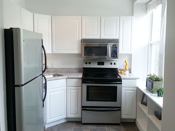 Sunny Kitchen with window and built-in bookcase